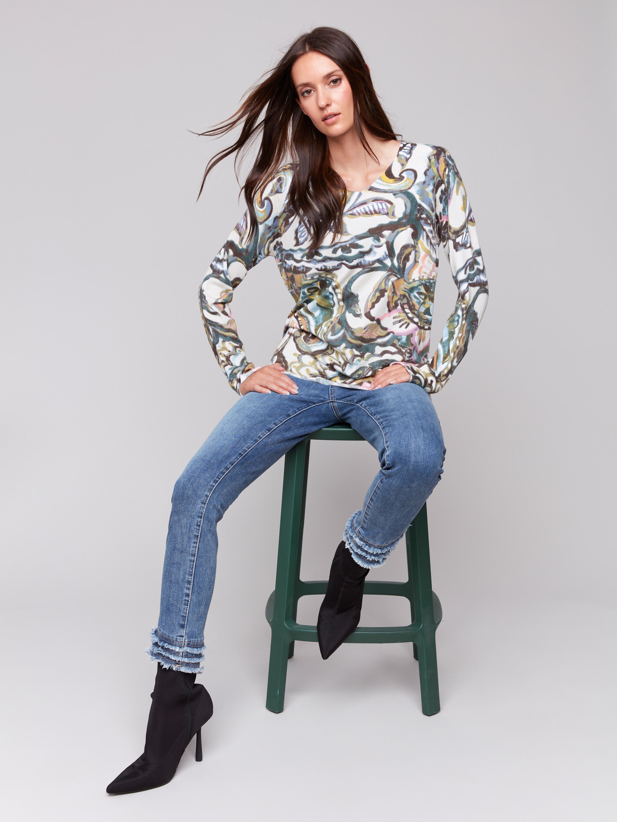 Abstract peacock pattern V-neck sweater with long sleeves by Charlie B.