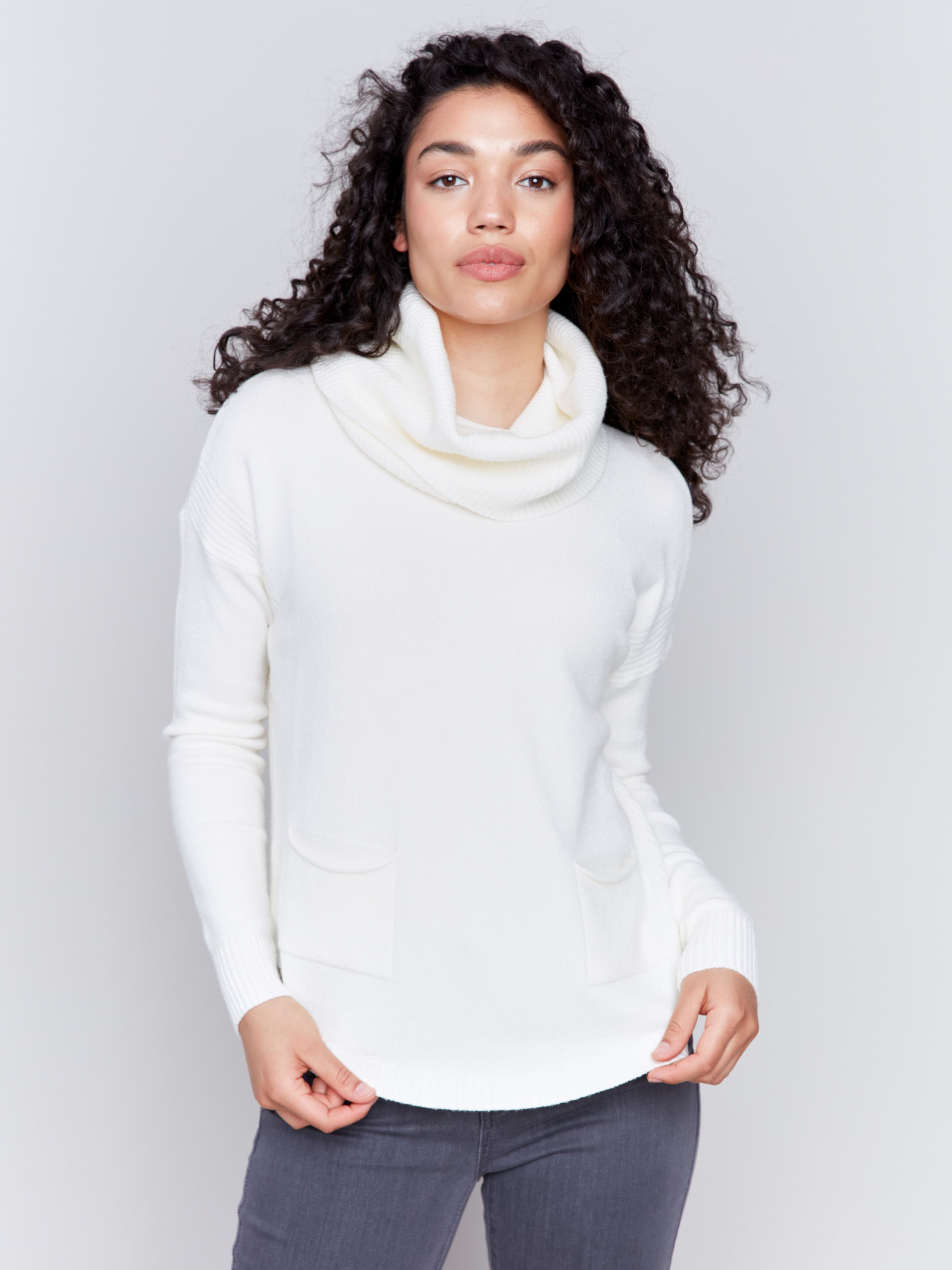 Ecru round hem sweater with a removable scarf and front pockets by Charlie B.