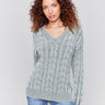 Spruce green cable knit sweater with a V-neckline, long sleeves, and geometric patterns by Charlie B.