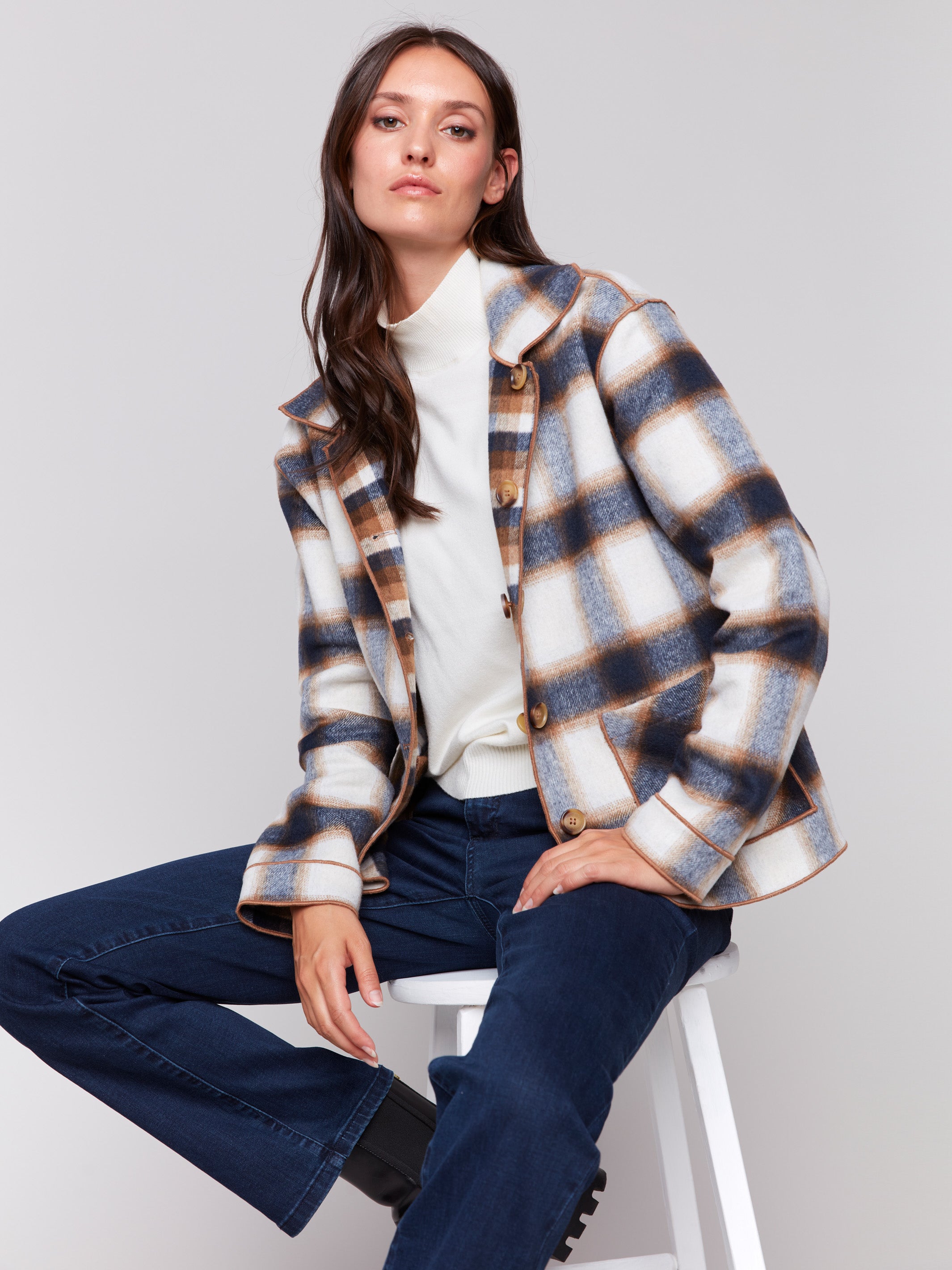 Reversible plaid jacket with button front and patch pockets by Charlie B. Demonstrated in a plaid pattern on each side, in shades of Truffle.