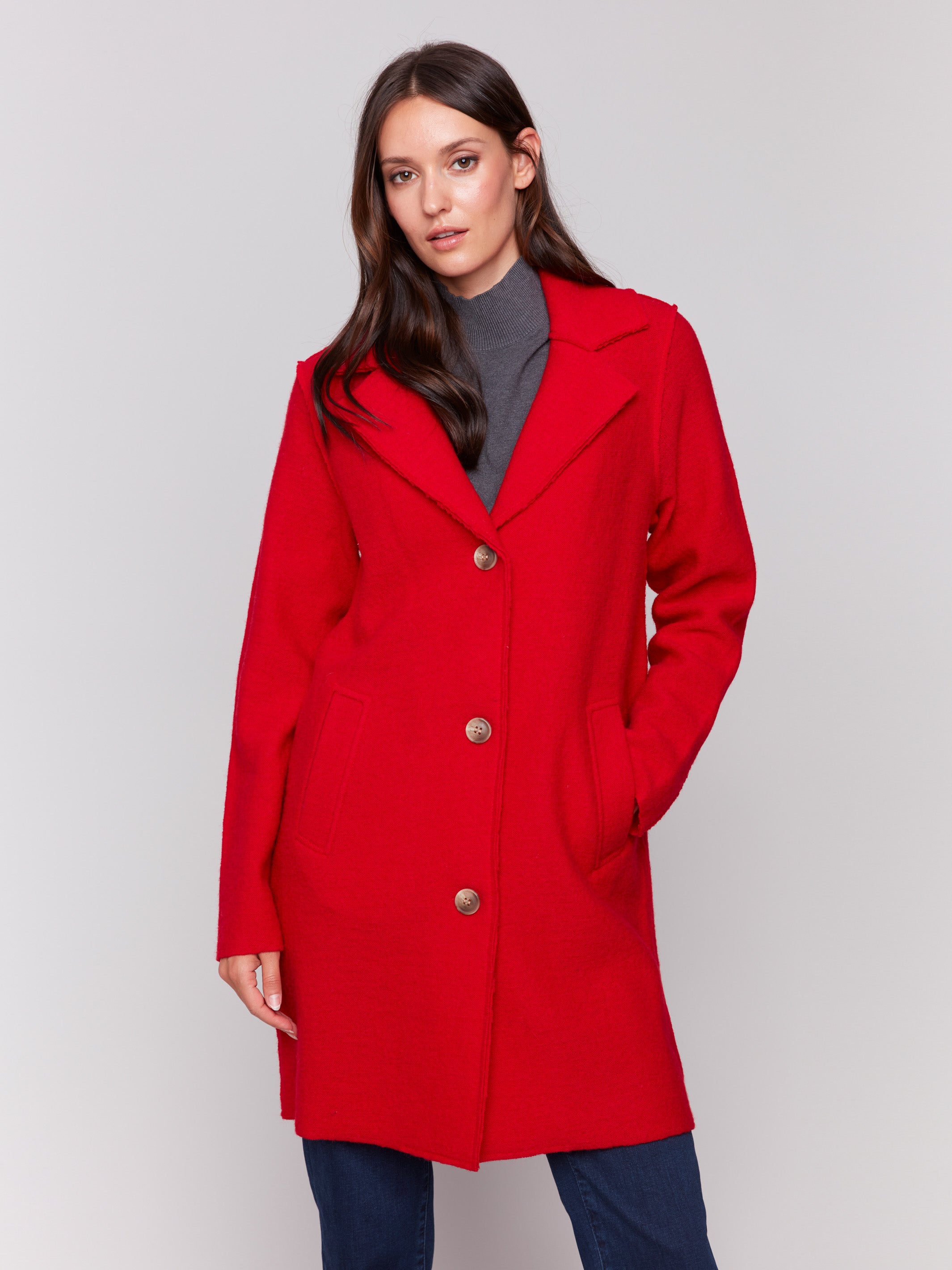 Cranberry long wool coat with lapel notch collar and button closures, featuring front welt pockets by Charlie B.