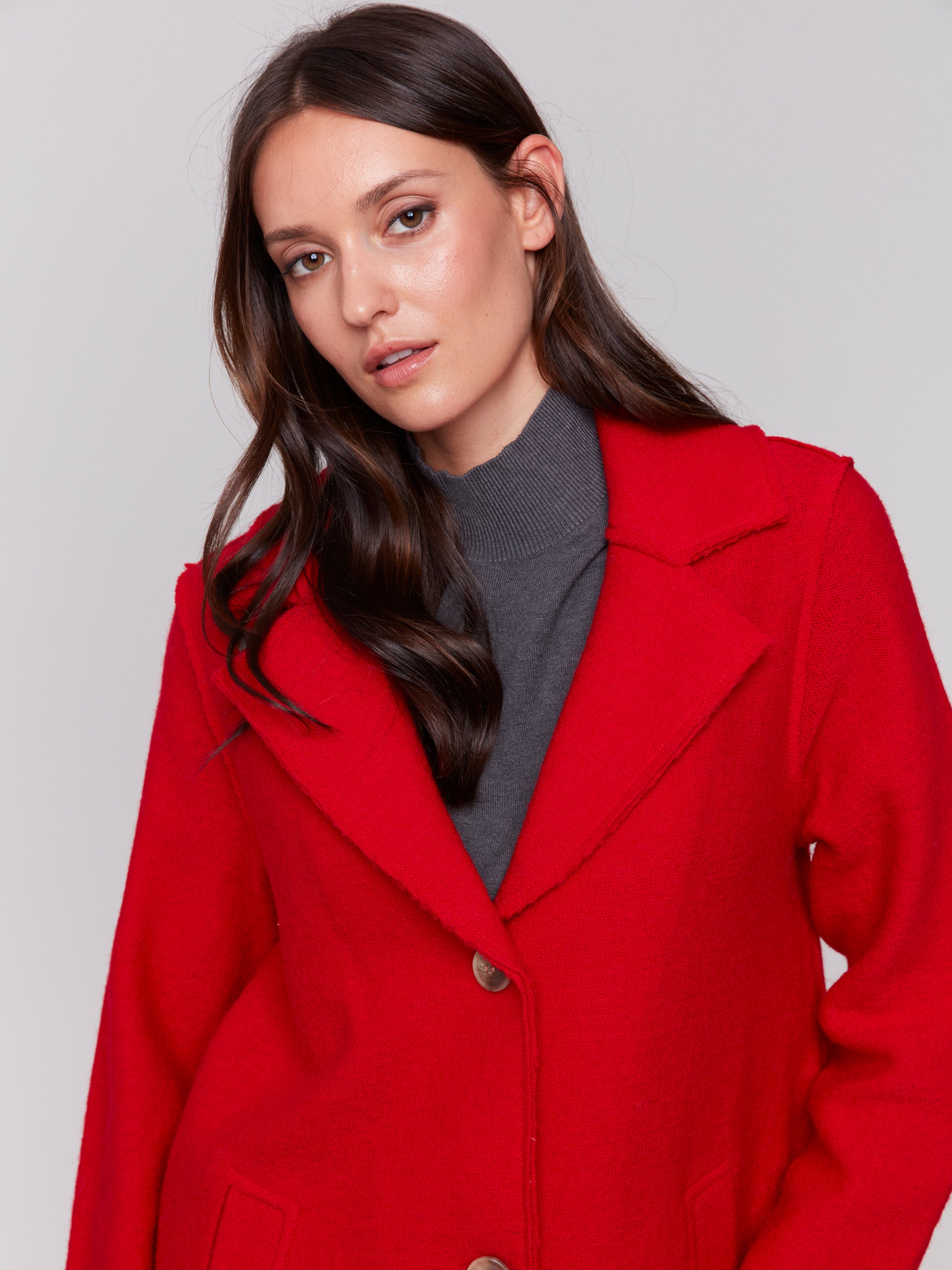 Cranberry long wool coat with lapel notch collar and button closures, featuring front welt pockets by Charlie B.