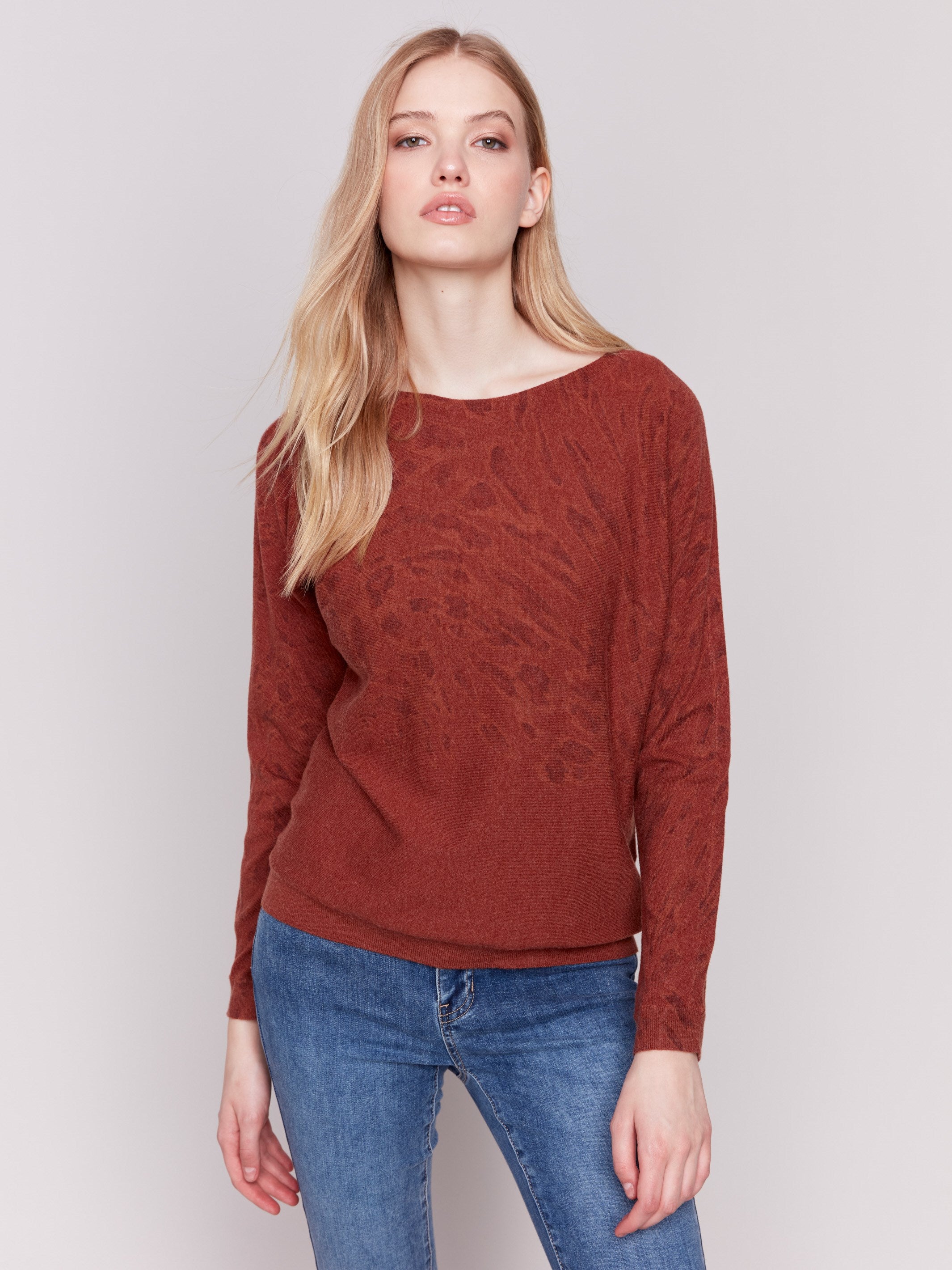 Terracotta animal print sweater with batwing sleeves and a relaxed fit by Charlie B.