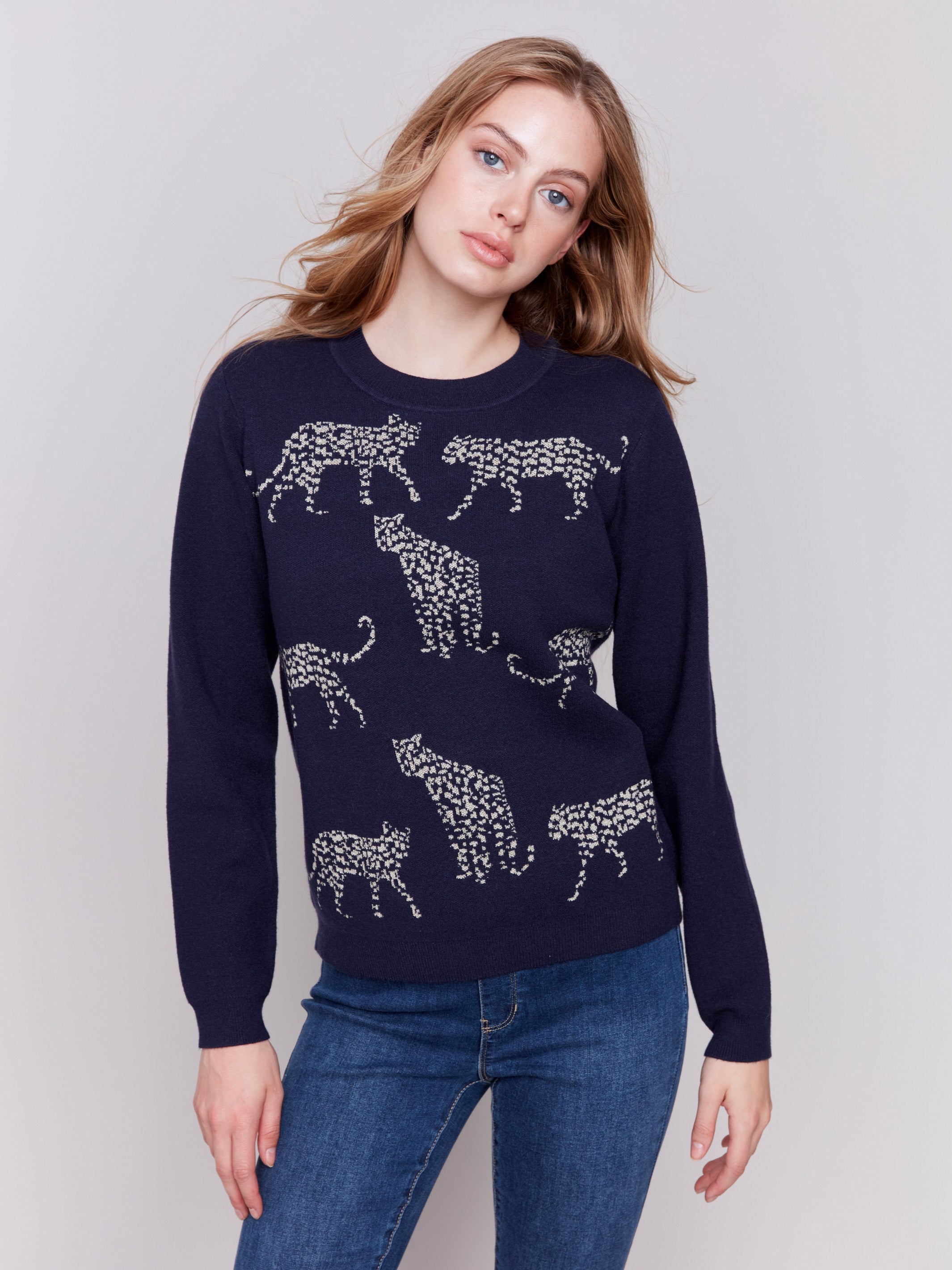 Navy blue sweater with jacquard cheetah pattern featuring a crew neckline and long sleeves by Charlie B.