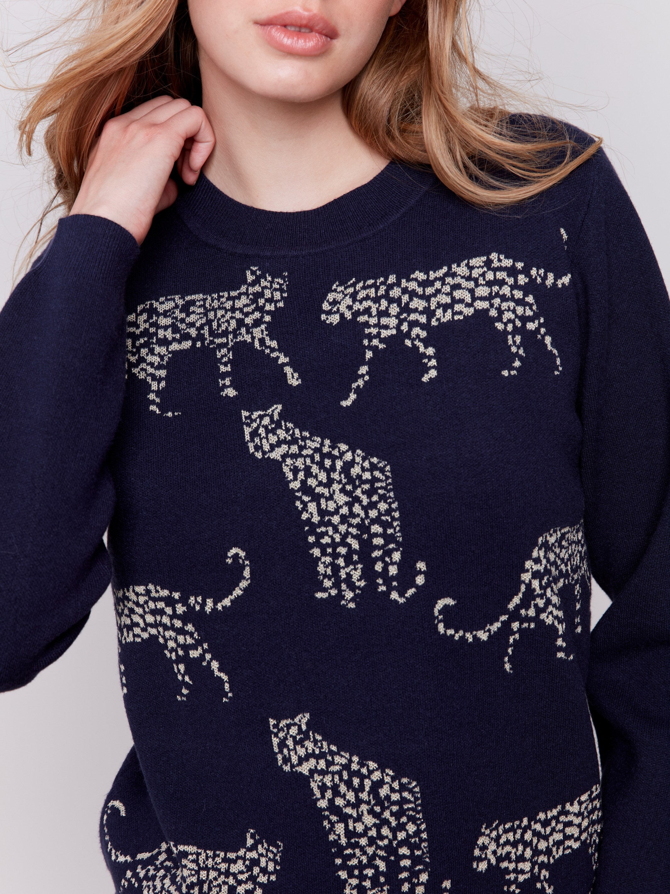 Navy blue sweater with jacquard cheetah pattern featuring a crew neckline and long sleeves by Charlie B.