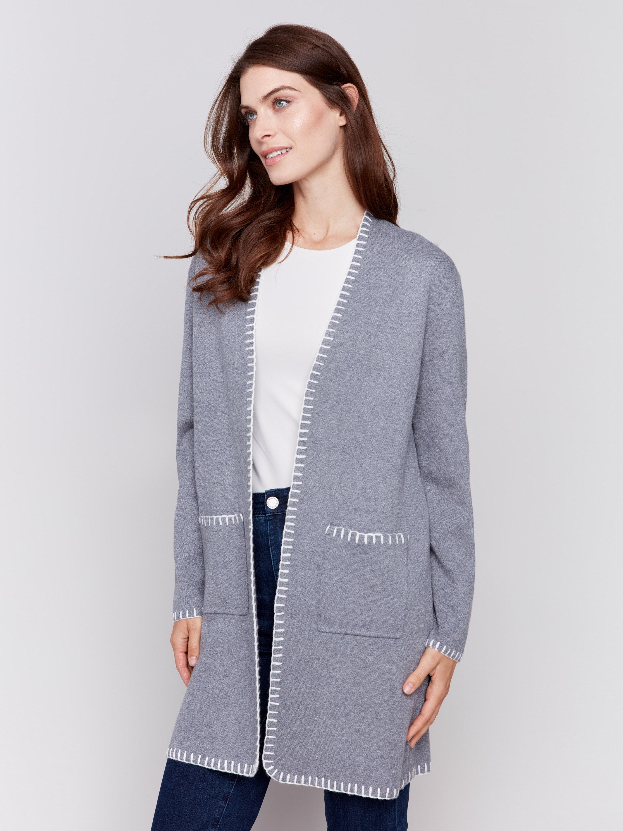 Grey long cardigan with white blanket stitch trim, featuring patch pockets and an open front by Charlie B.