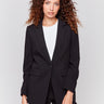 Black blazer featuring a ruched back detail, single button closure, and front flap pockets by Charlie B.