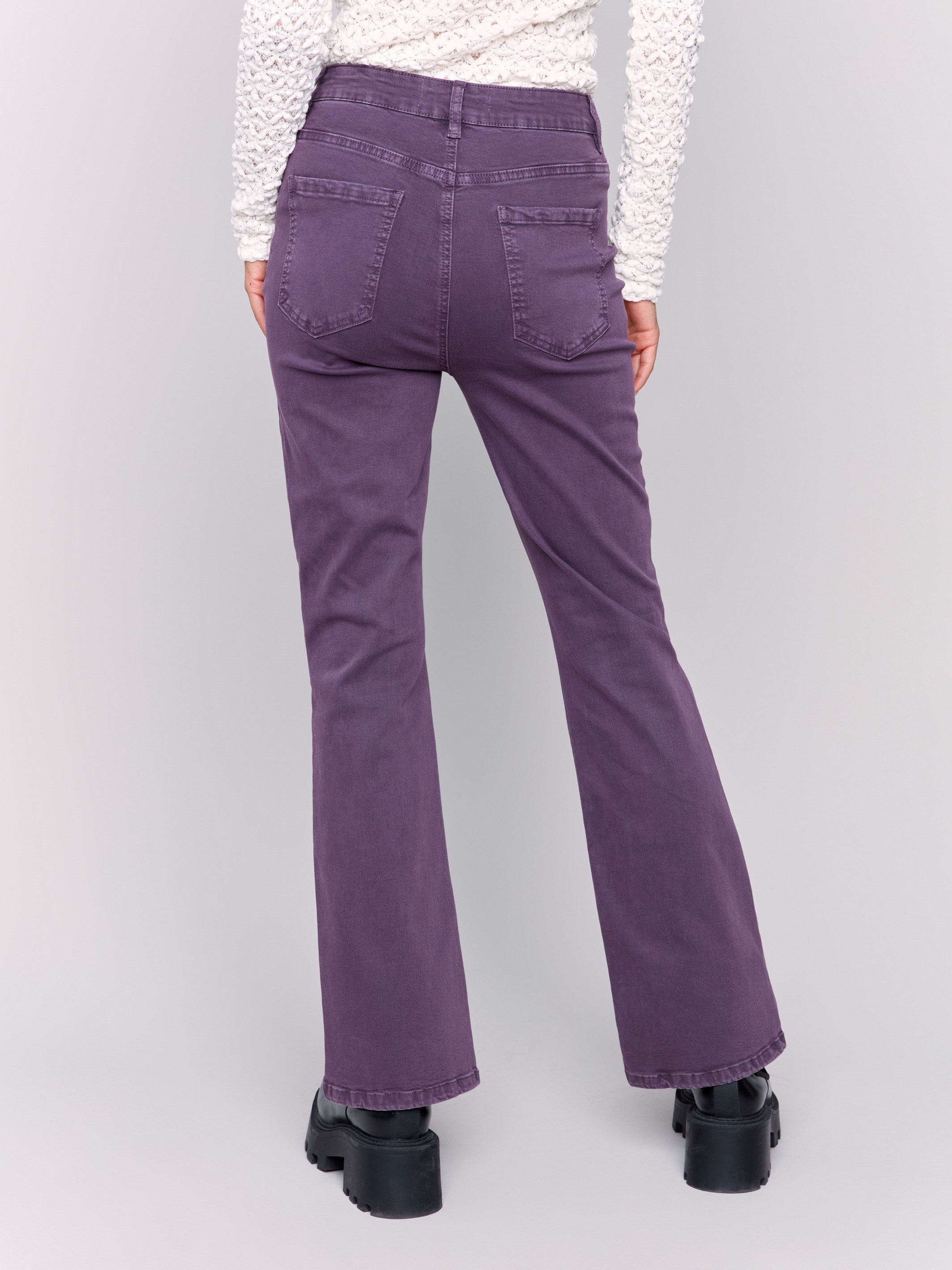 Plum bootcut twill pants with a mid-rise and bootcut fit, showcasing five-pocket design by Charlie B.