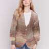 Brown, beige, and cream mix long-sleeve cardigan with front button closure by Charlie B.