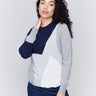 Color block sweater in shades of navy and grey with a crew neckline and long sleeves by Charlie B.