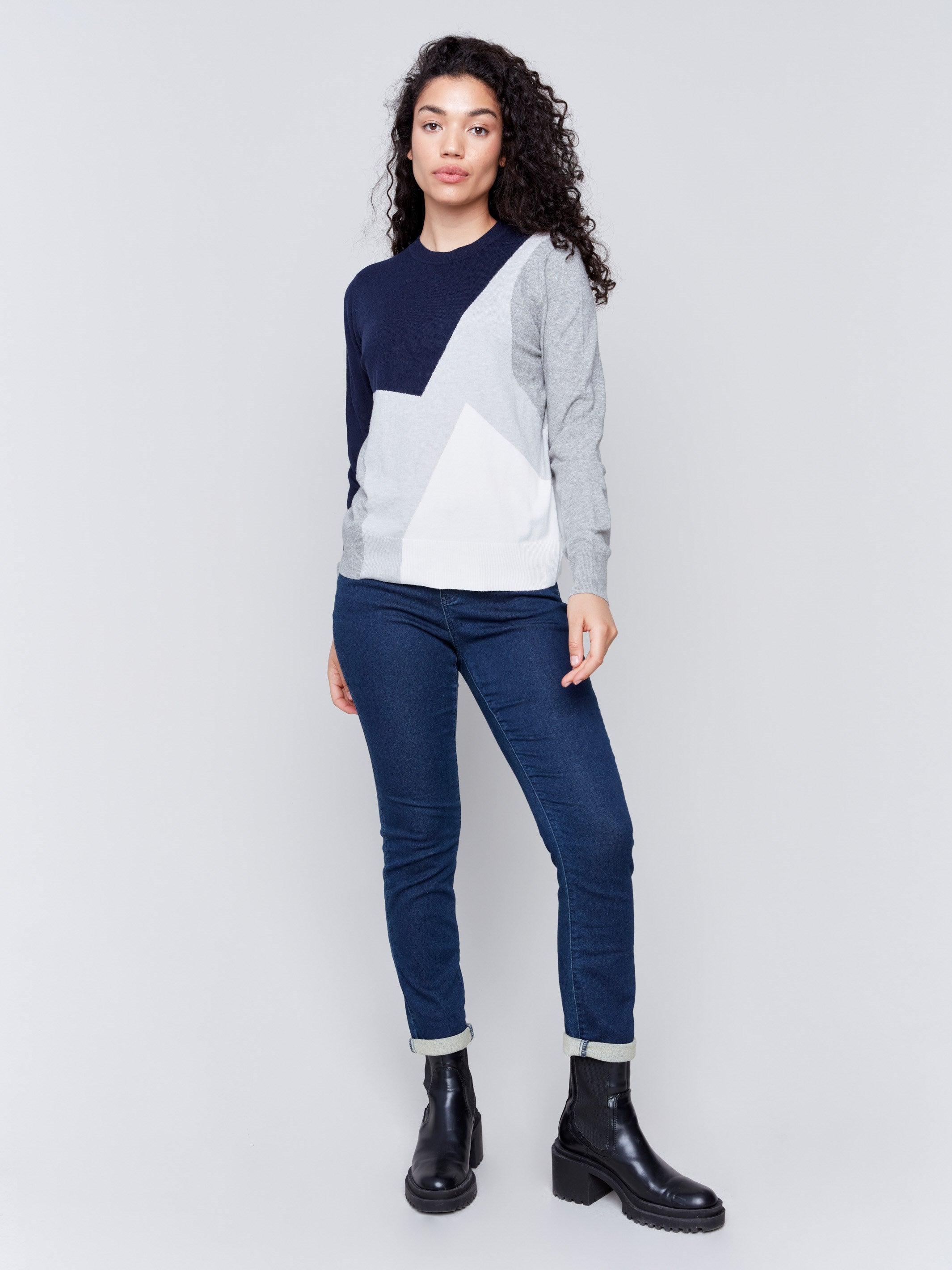 Color block sweater in shades of navy and grey with a crew neckline and long sleeves by Charlie B.