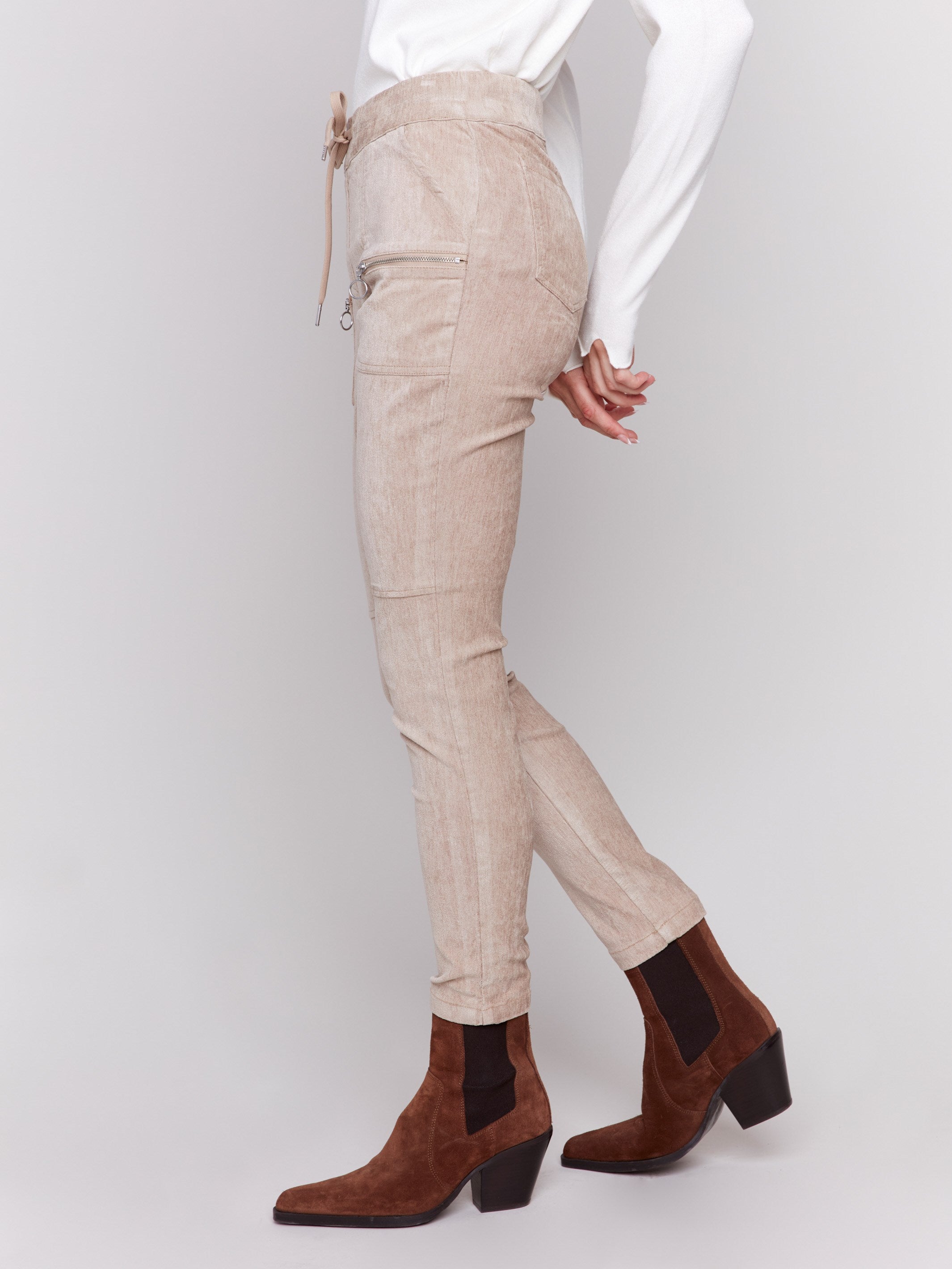 Almond beige corduroy jogger pants with an elastic waistband, drawstrings, and slim fit by Charlie B.