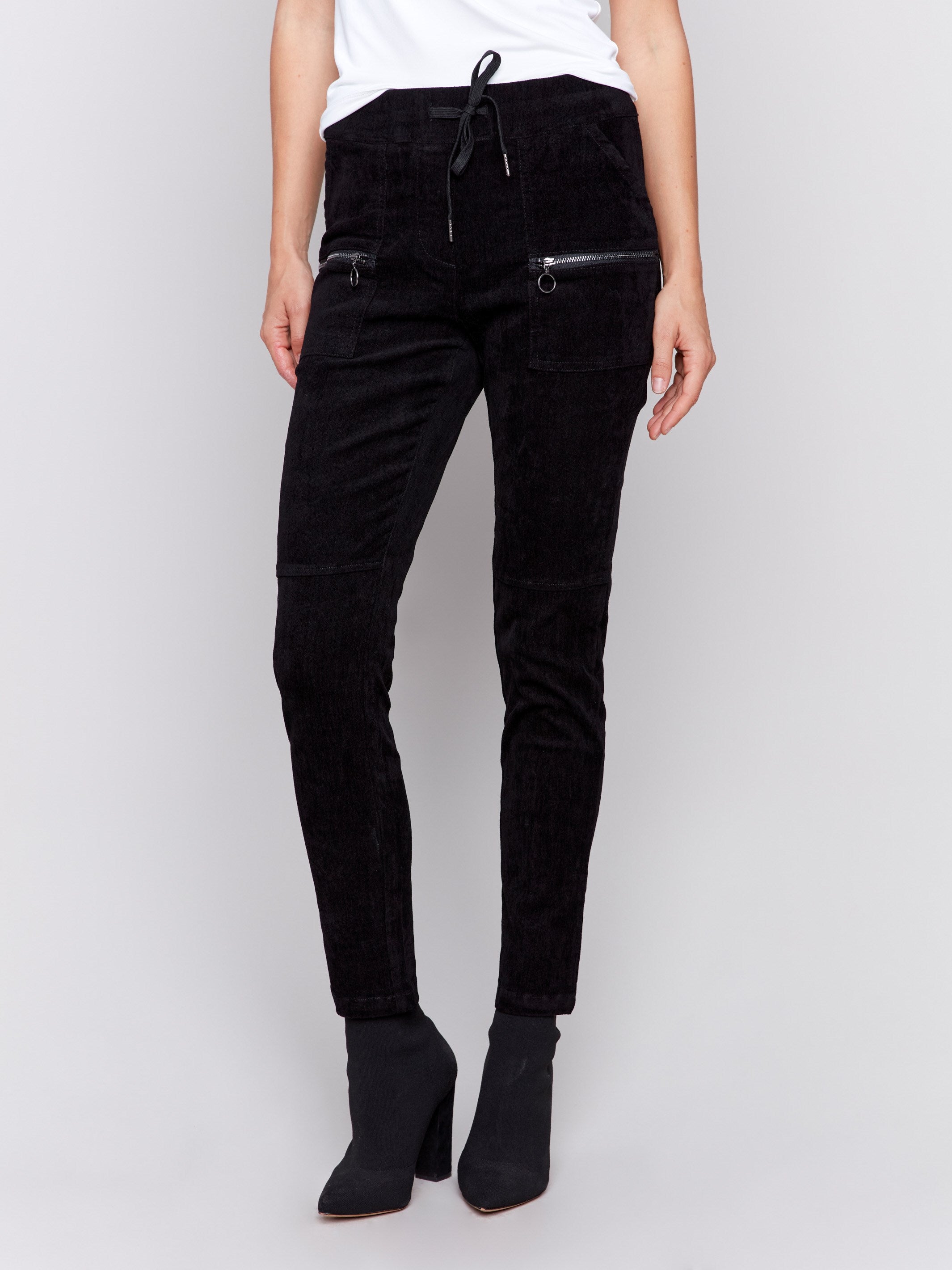 Black corduroy jogger pants with an elastic waistband, drawstrings, and slim fit by Charlie B.