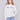 Ecru white sweater with colorful 'Amour' letters embroidered on the chest, featuring long sleeves and a crew neckline by Charlie B.