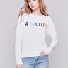 Ecru white sweater with colorful 'Amour' letters embroidered on the chest, featuring long sleeves and a crew neckline by Charlie B.