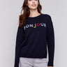 Navy sweater with colorful 'Bonjour' letters embroidered on the chest, featuring long sleeves and a crew neckline by Charlie B.