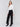 High-rise black crepe flare pants featuring decorative buttons along the waistline; sleek, elegant design perfect for formal and casual occasions, by Charlie B.