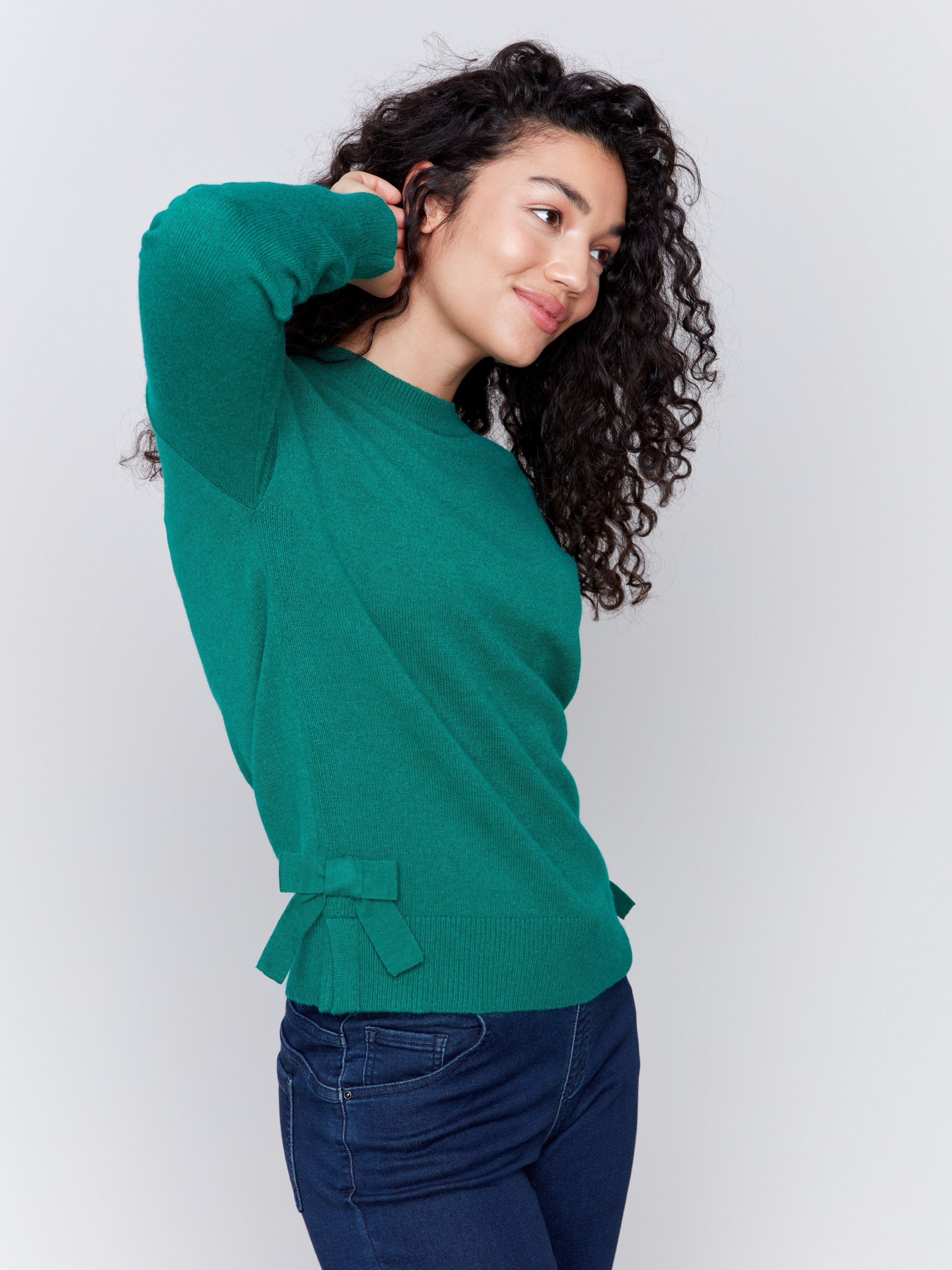 Forest green long-sleeve crew neck sweater with side bow details by Charlie B.