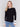 Black crew neck sweater with white accents and side slit, long sleeves, ideal for a casual look by Charlie B.