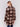 Chocolate crochet coat with colorful geometric patterns, featuring a front button closure and side welt pockets by Charlie B.