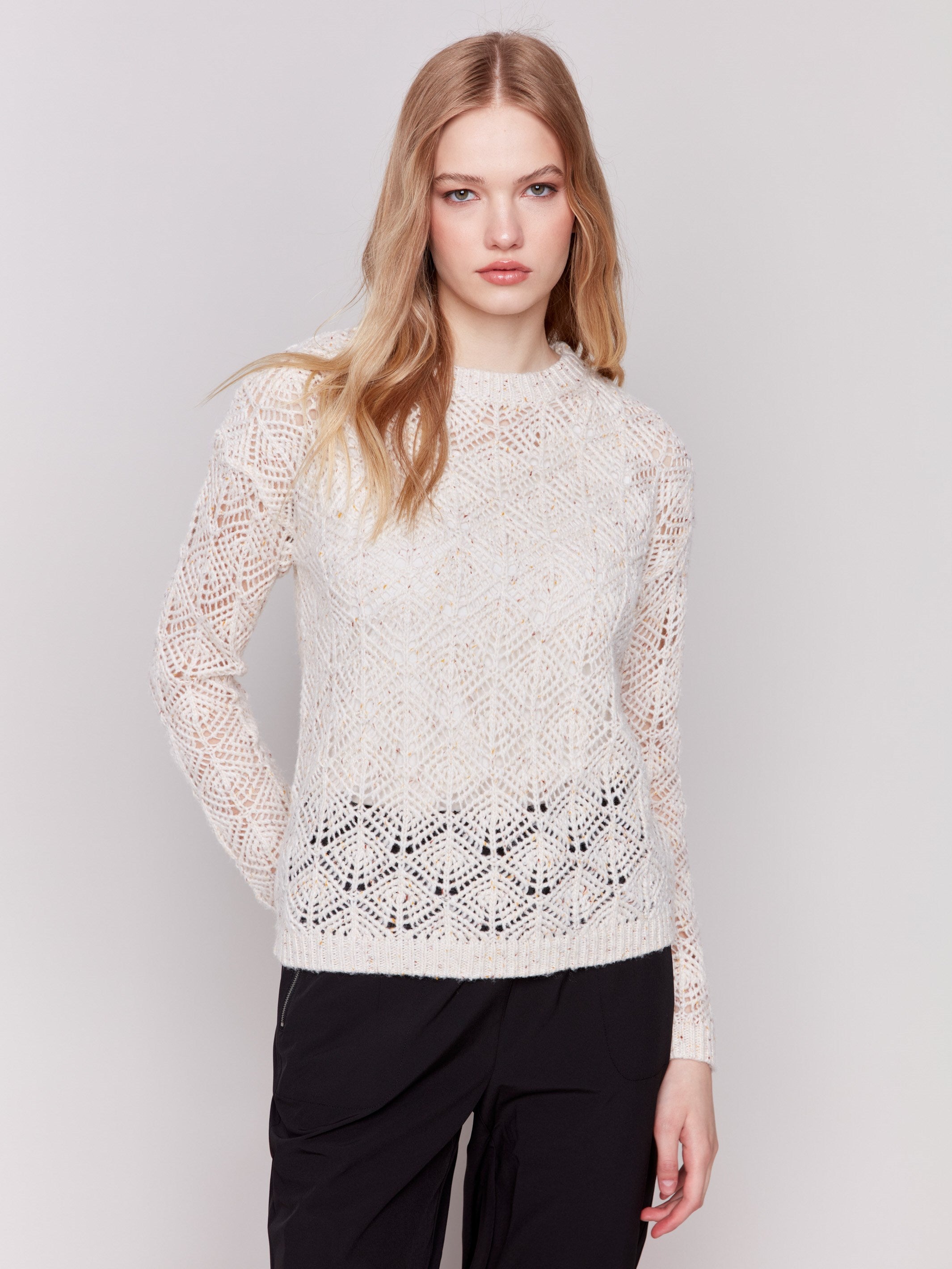 Oatmeal beige crochet knit sweater with a round neckline and drop shoulders by Charlie B.