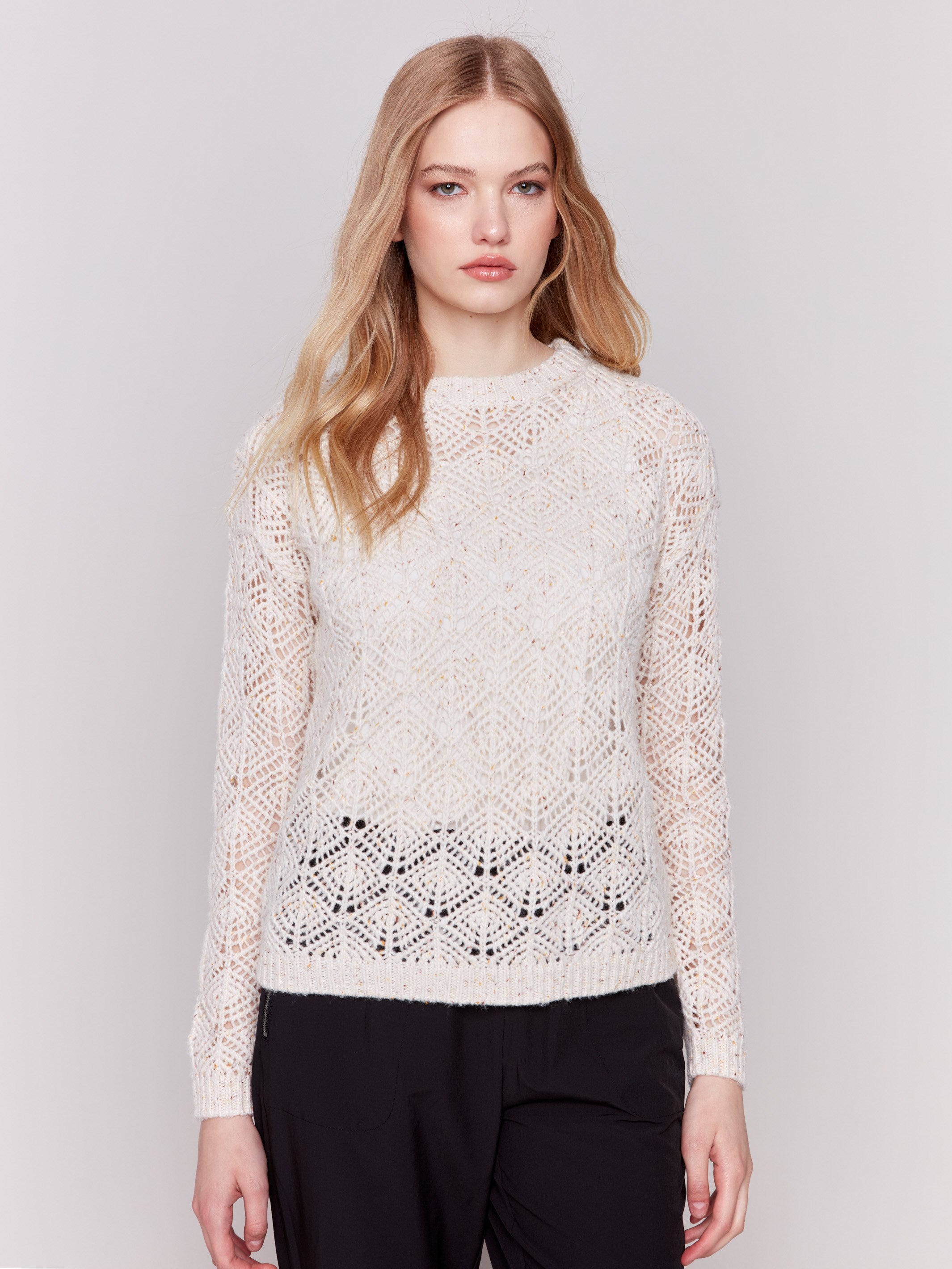 Oatmeal beige crochet knit sweater with a round neckline and drop shoulders by Charlie B.