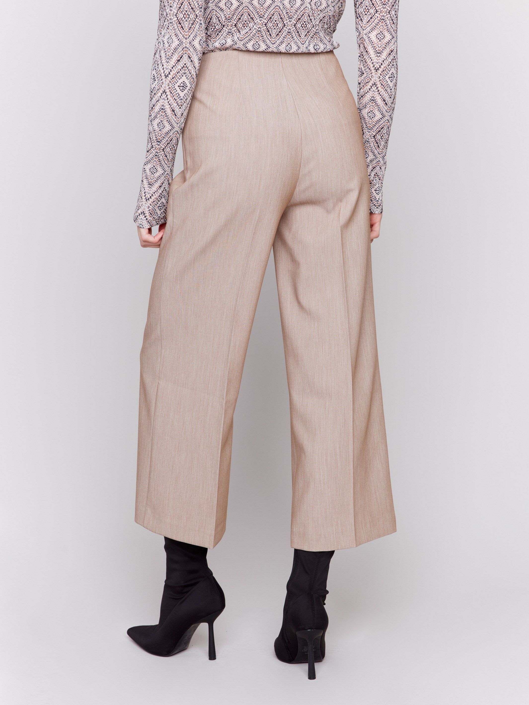 Beige cropped wide-leg pants with a side zipper closure by Charlie B, perfect for professional or casual settings.