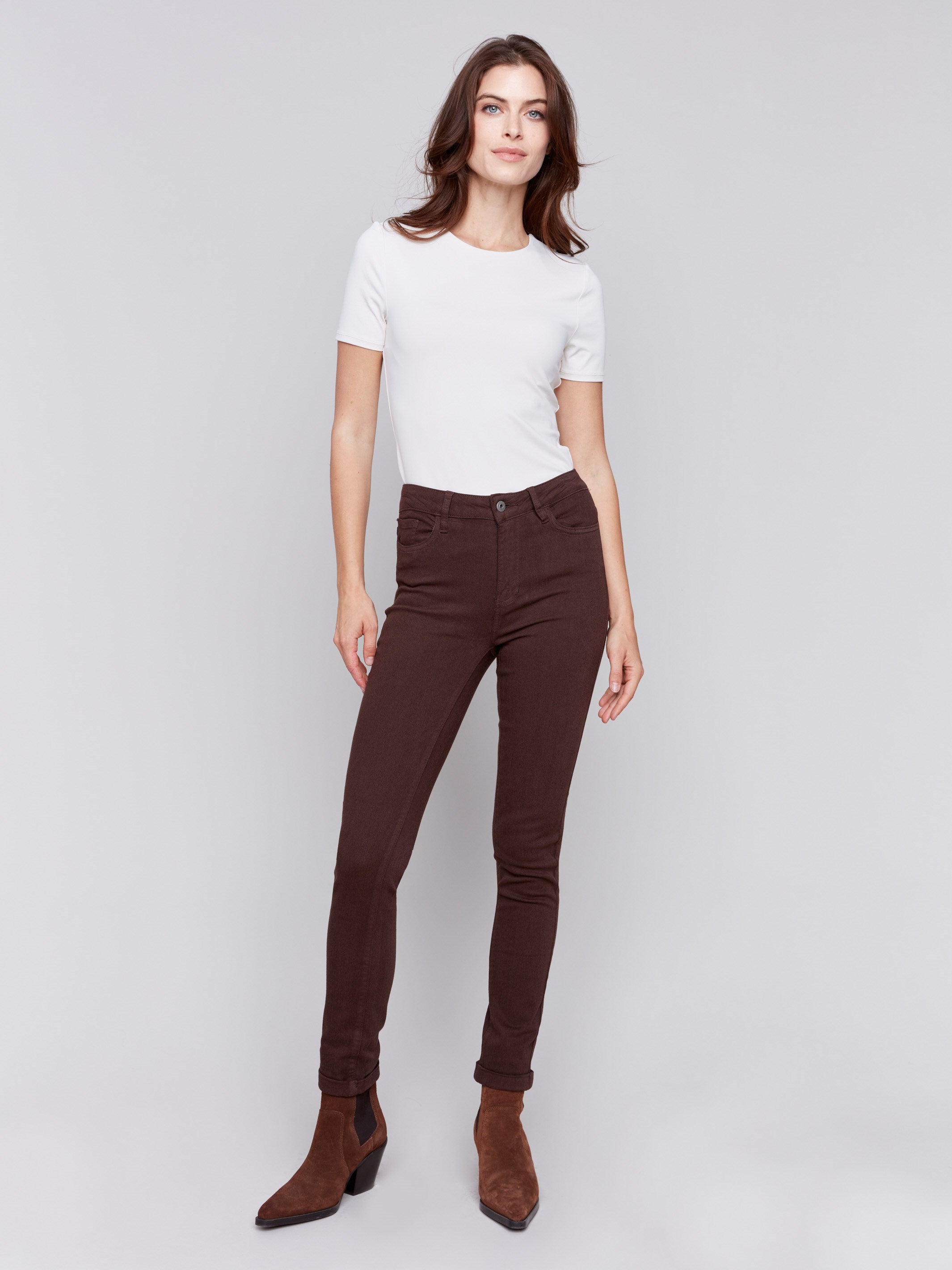 Mocha brown slim-leg twill jeans with a cuffed hem and a classic five-pocket design by Charlie B.