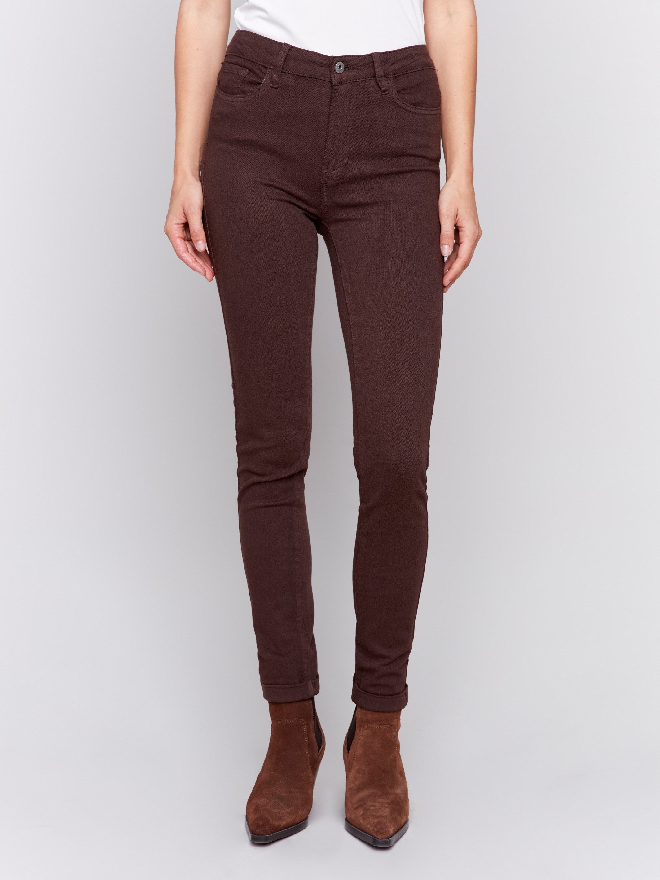 Mocha brown slim-leg twill jeans with a cuffed hem and a classic five-pocket design by Charlie B.