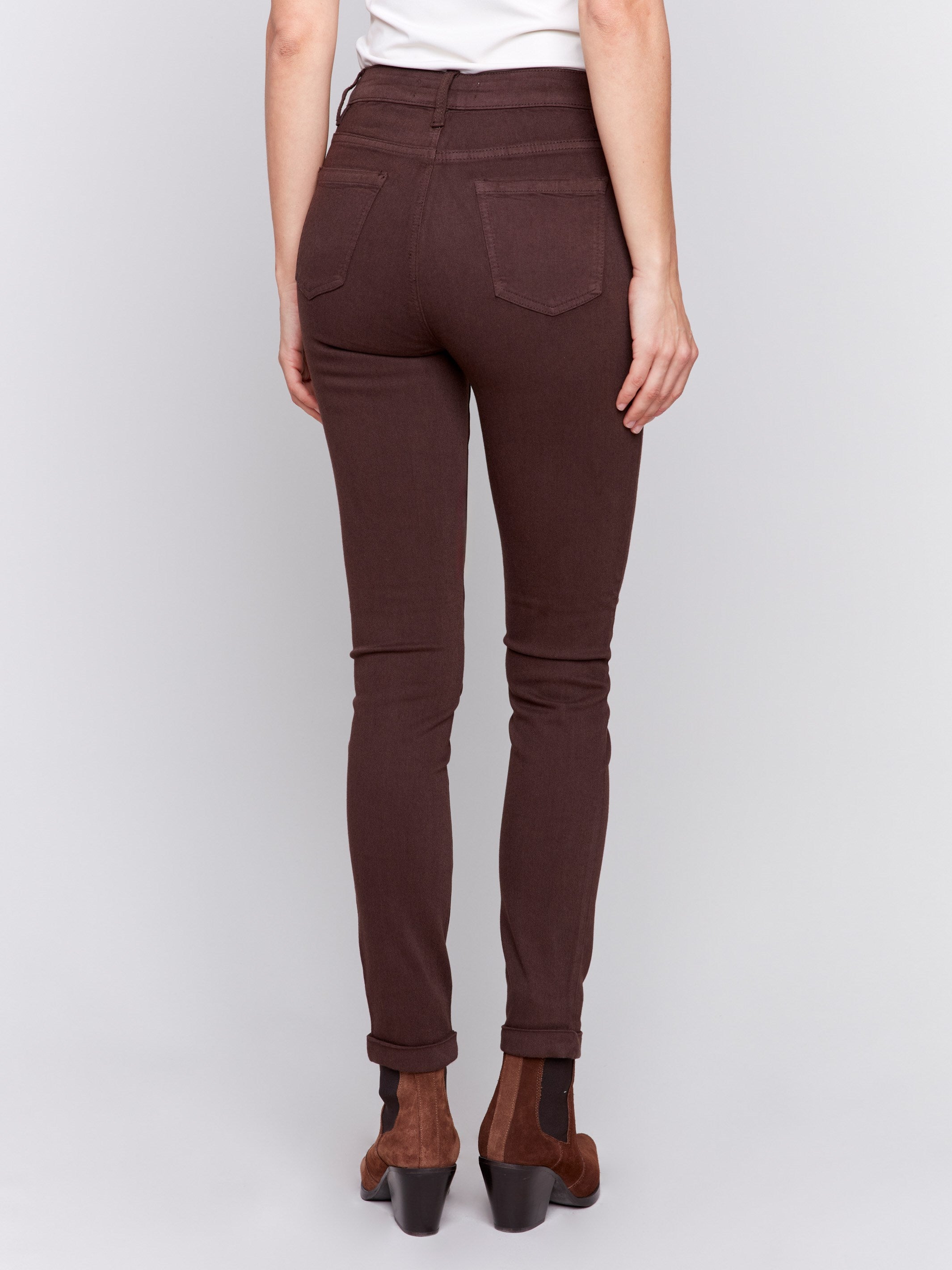 Mocha brown slim-leg twill jeans with a cuffed hem and a classic five-pocket design by Charlie B.