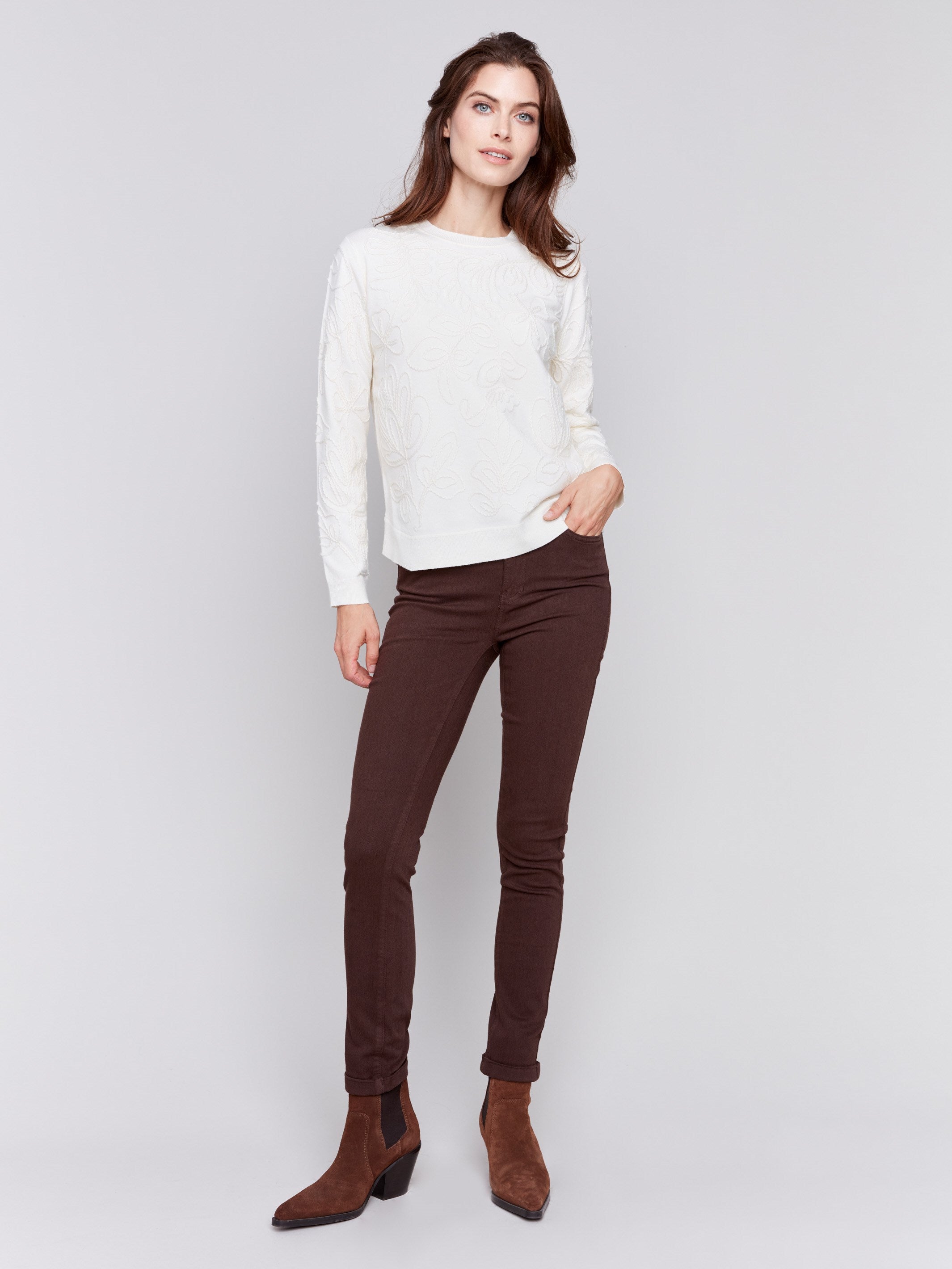 Mocha brown slim-leg twill jeans with a cuffed hem and a classic five-pocket design by Charlie B.