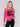 Magenta pink crew neck sweater featuring embroidered city names in black by Charlie B.