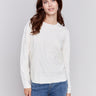 White sweater with floral embroidery, long sleeves, and a round neckline by Charlie B.