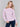 Light pink sweater with floral embroidery, long sleeves, and a crew neckline by Charlie B.