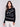 Black jacquard knit sweater featuring abstract embroidery and a round hemline by Charlie B.