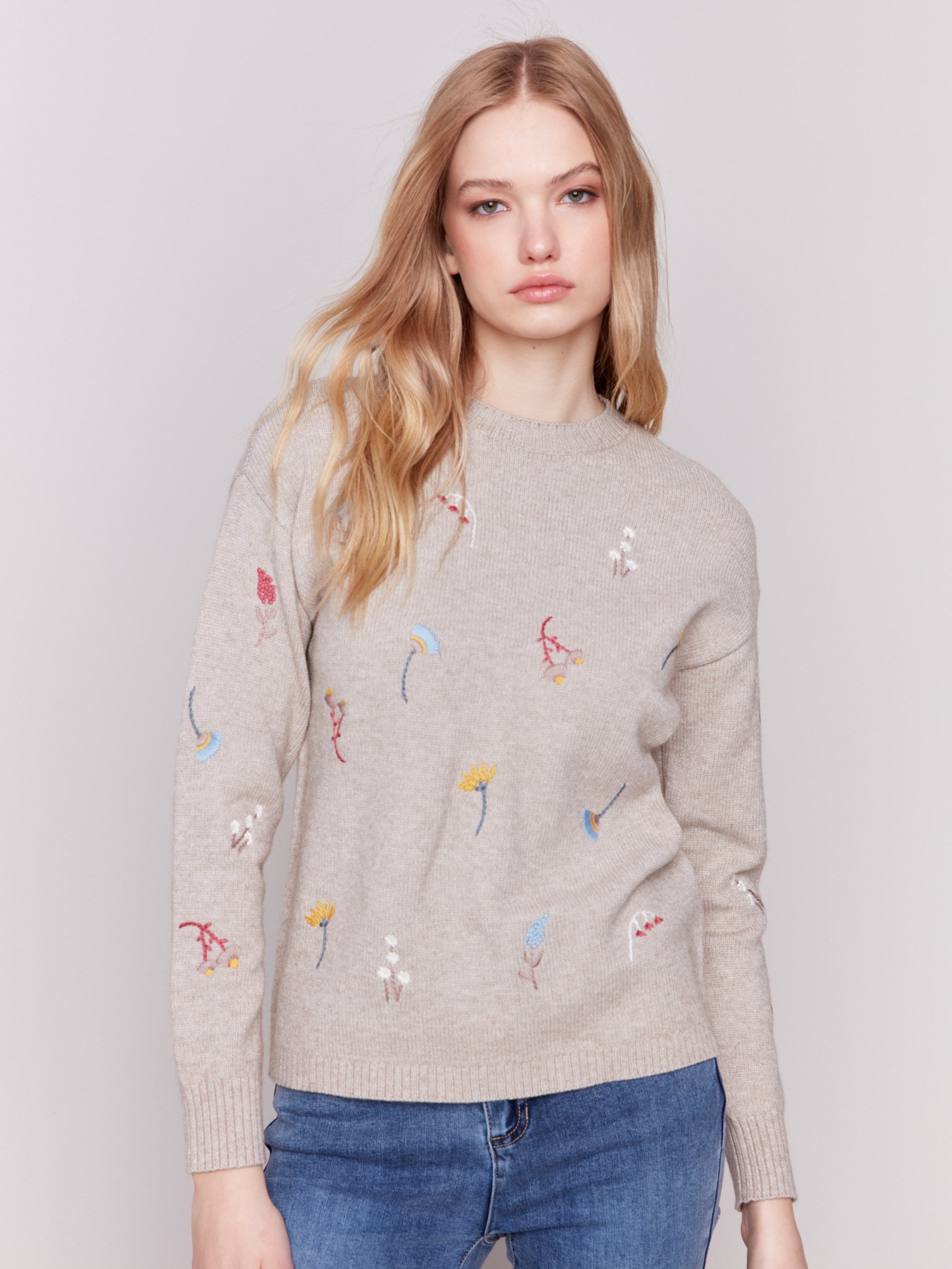 Cozy Almond beige sweater with floral embroidery, featuring long sleeves and a crew neckline by Charlie B.