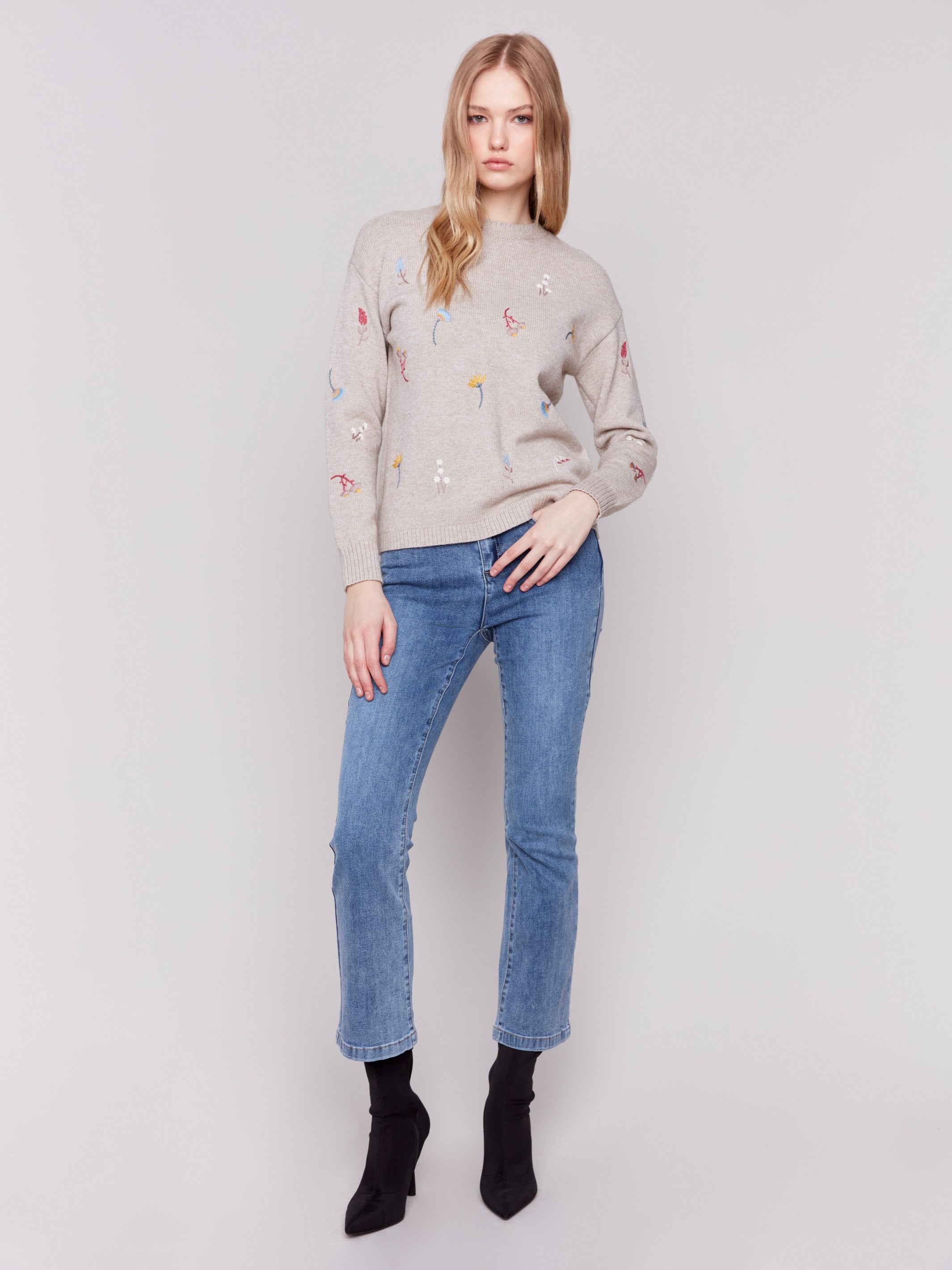 Cozy Almond beige sweater with floral embroidery, featuring long sleeves and a crew neckline by Charlie B.