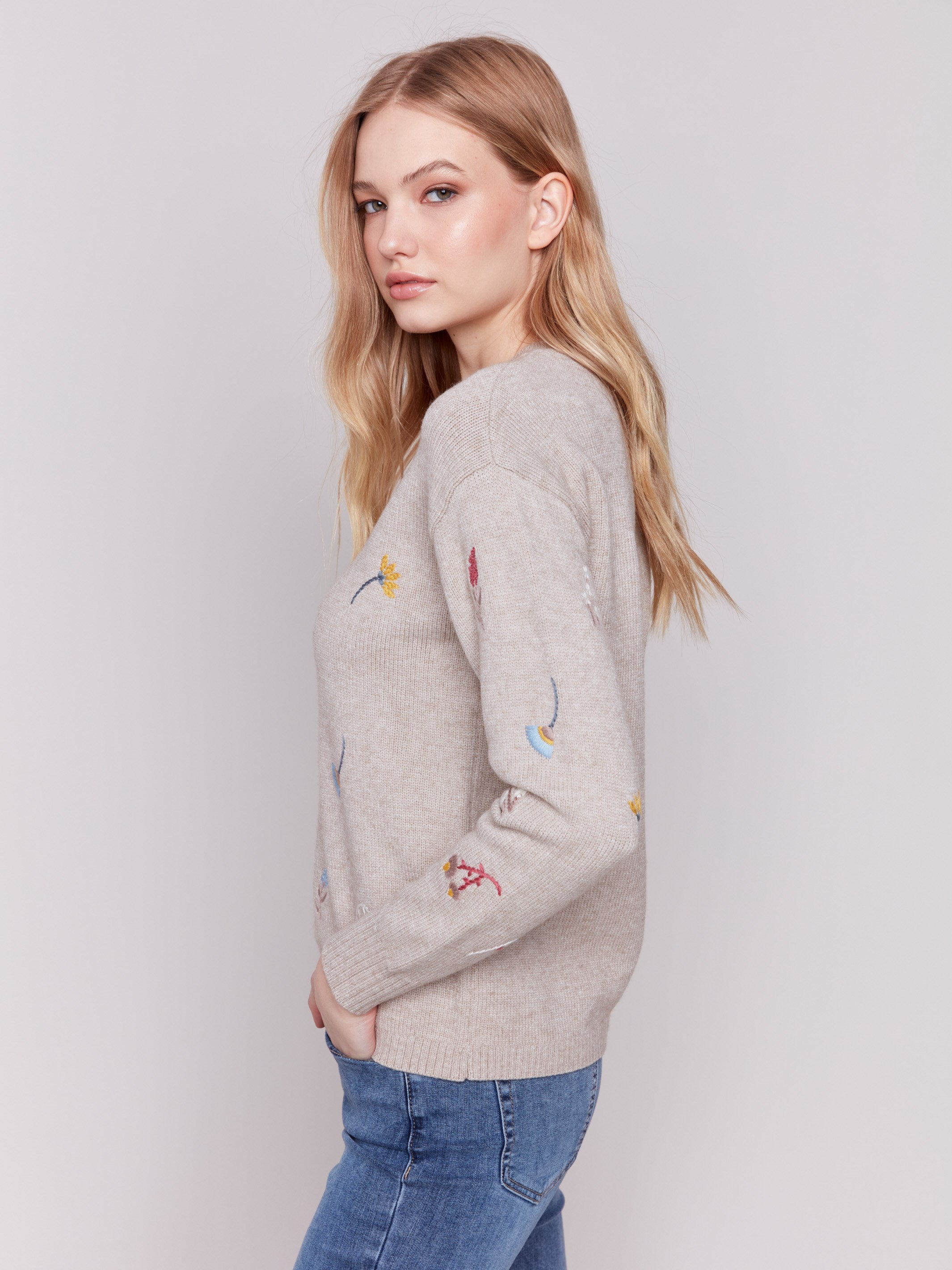 Cozy Almond beige sweater with floral embroidery, featuring long sleeves and a crew neckline by Charlie B.