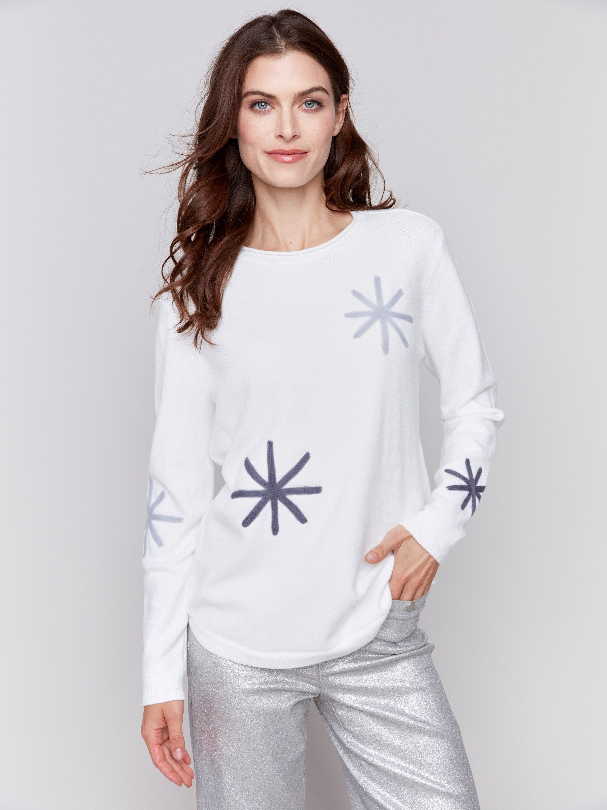 Ecru whitelong-sleeve sweater with snowflake embroidery and rounded hem by Charlie B.