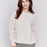 Almond beige crew neck sweater with fishnet sleeves, offering a plushy knit texture, designed by Charlie B.