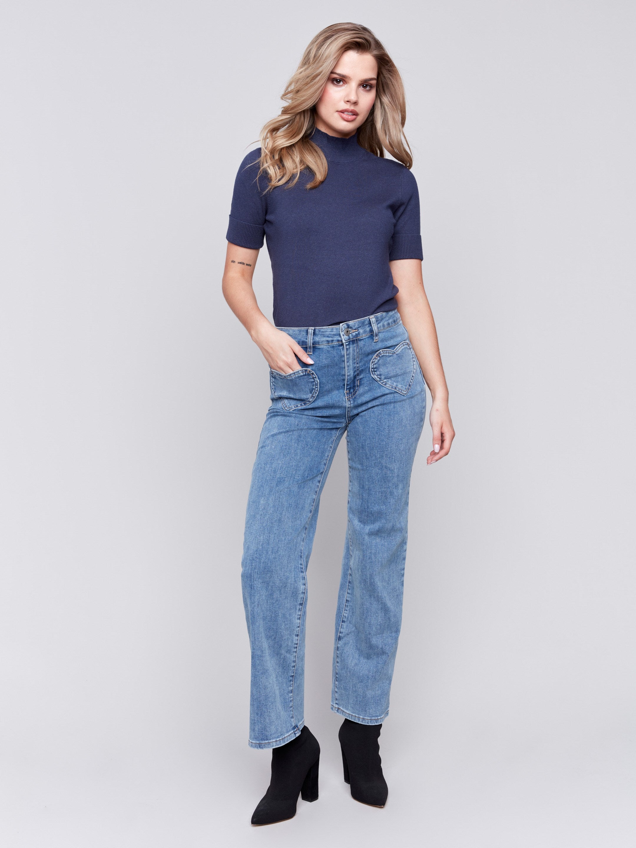 Medium blue flare jeans with heart-shaped front pockets by Charlie B.