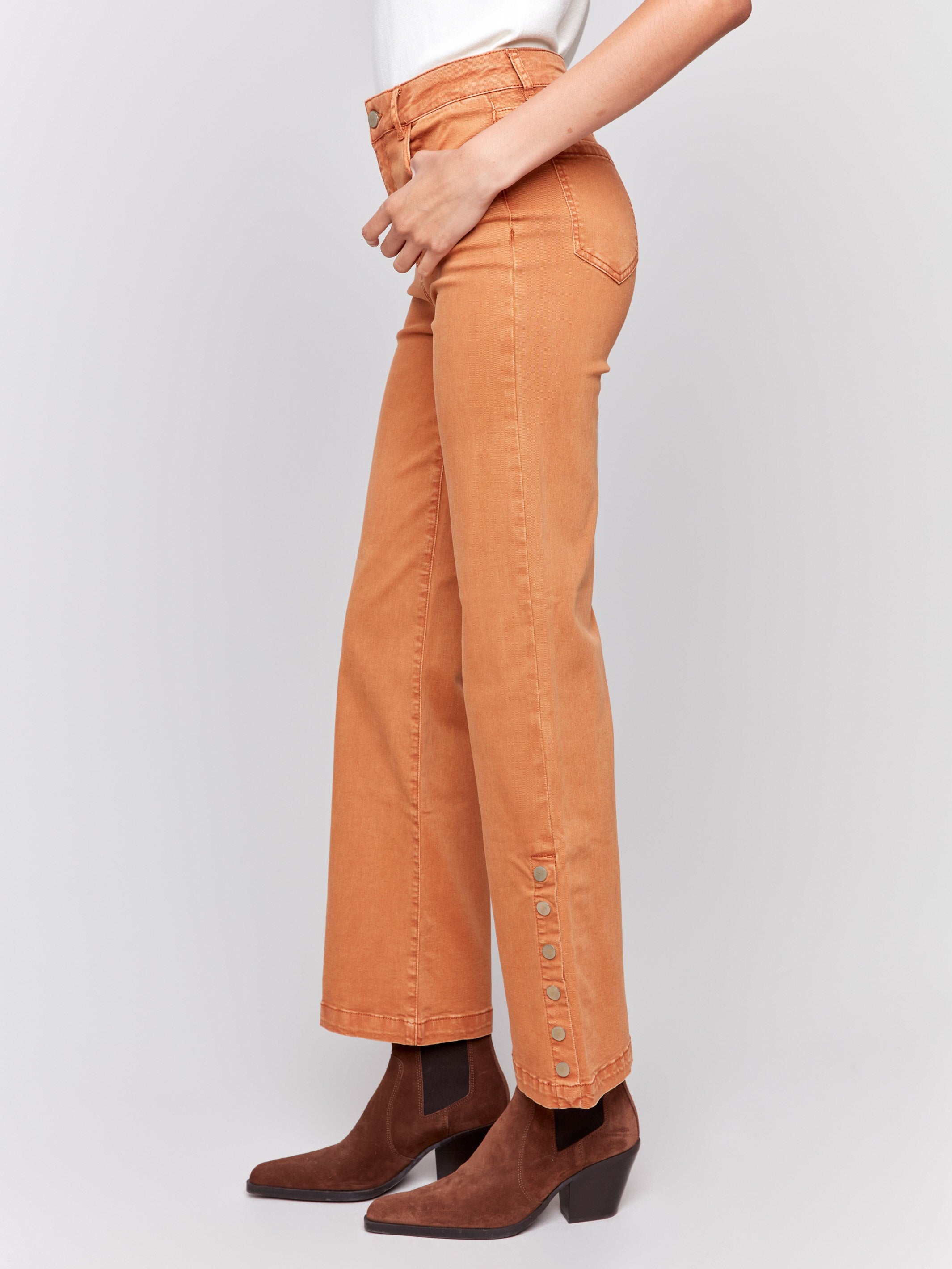 Ginger-colored flare twill jeans with side buttons, featuring a regular rise, five-pocket design, and slim leg fit by Charlie B.