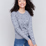 Grey plushy knit sweater with floral embroidery, crew neck, and long sleeves by Charlie B.