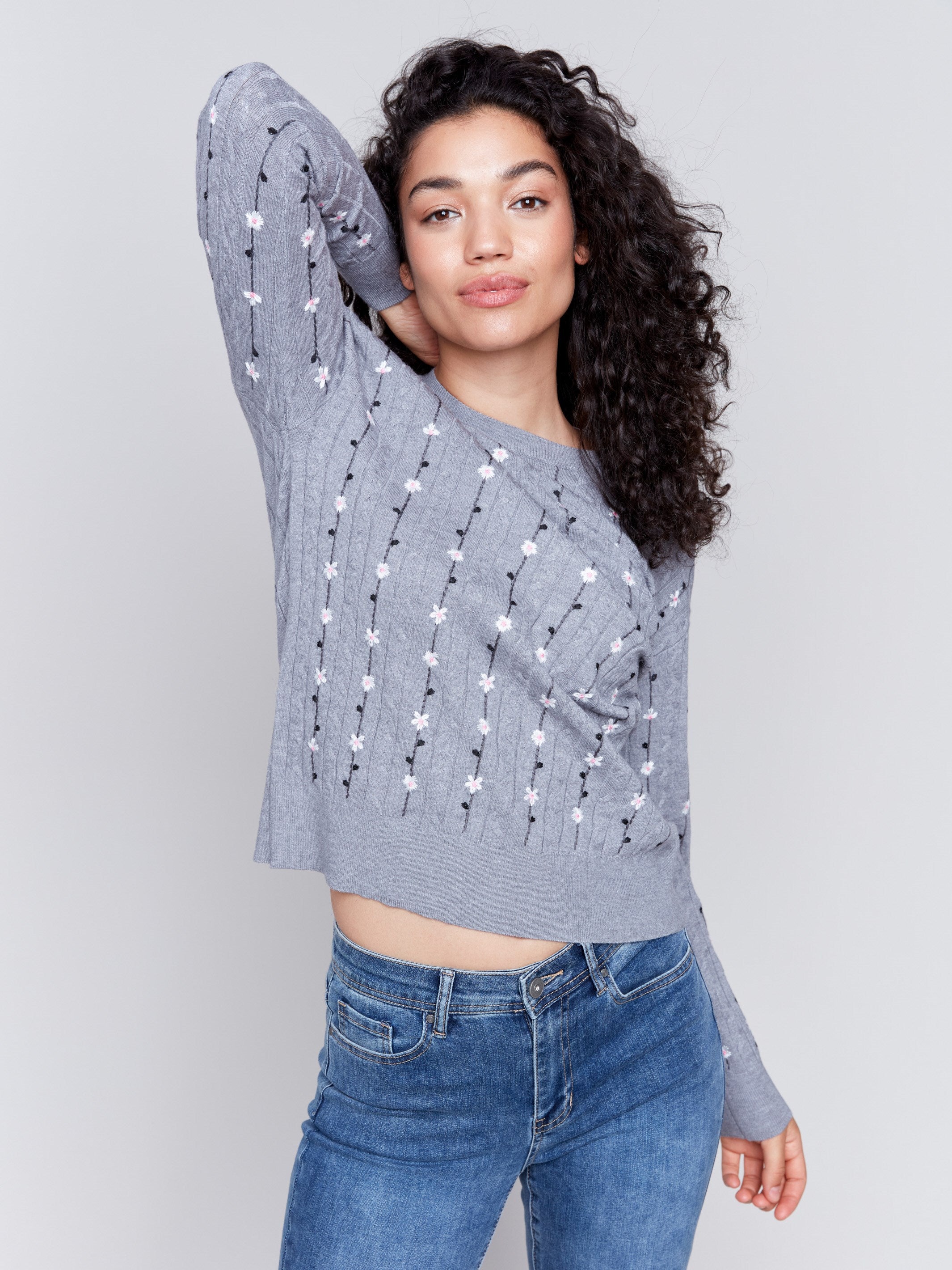 Grey plushy knit sweater with floral embroidery, crew neck, and long sleeves by Charlie B.