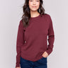 Cabernet red long-sleeve sweater with a crew neck and frayed rounded hem by Charlie B.