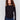 Black long-sleeve sweater with a crew neck and frayed rounded hem by Charlie B.