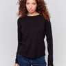 Black long-sleeve sweater with a crew neck and frayed rounded hem by Charlie B.