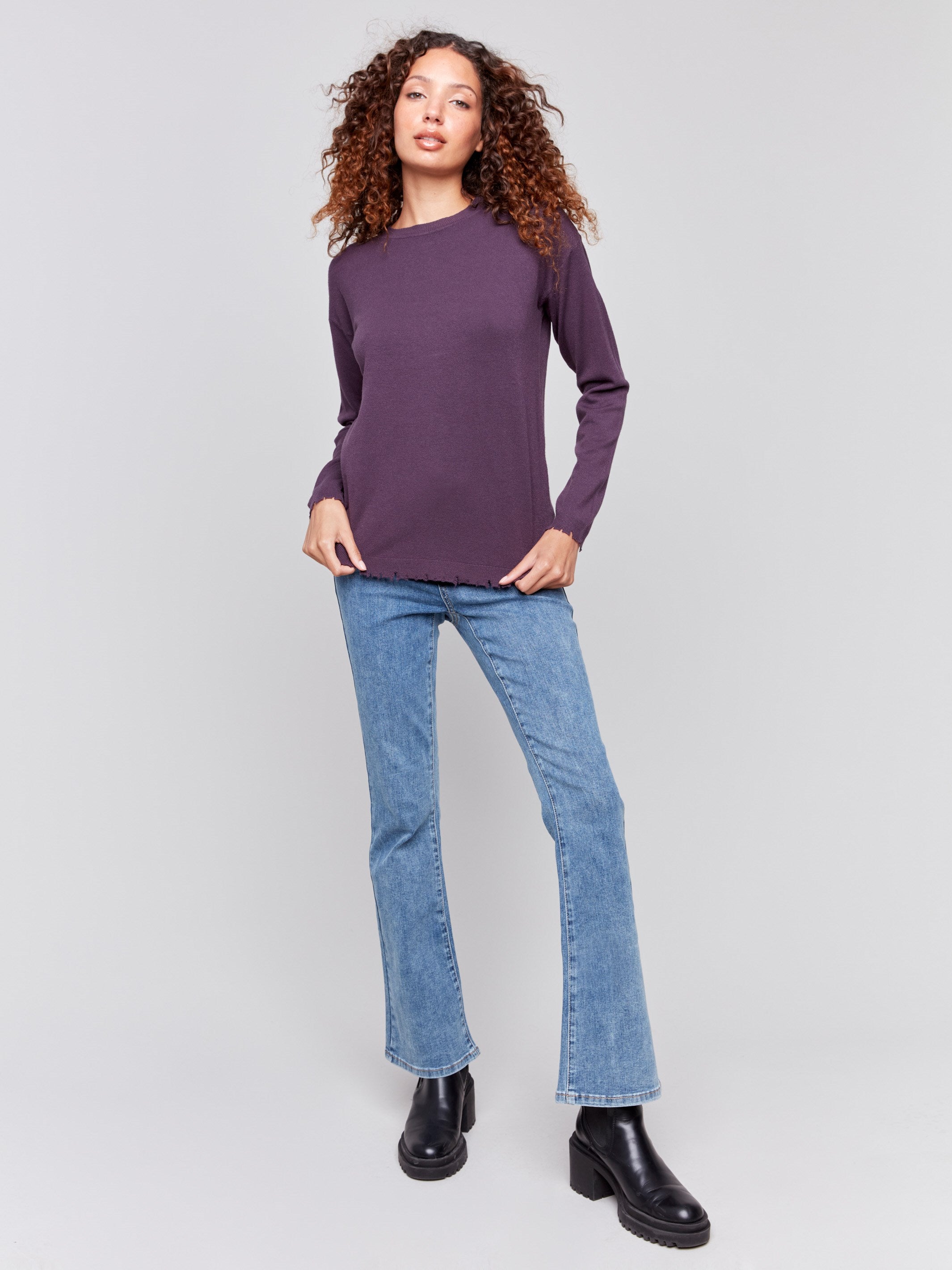 Plum purple long-sleeve sweater with a crew neck and frayed rounded hem by Charlie B.