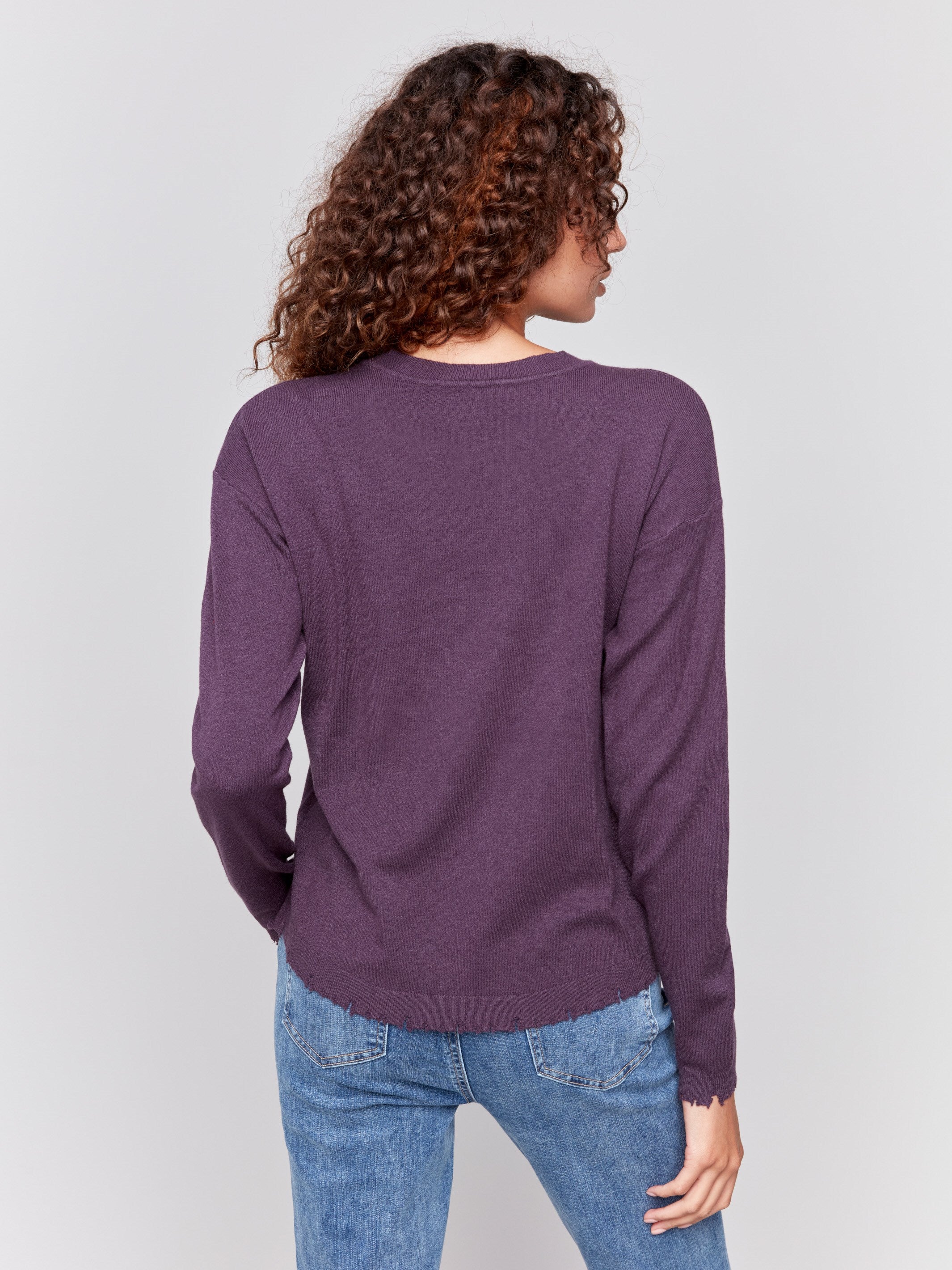 Plum purple long-sleeve sweater with a crew neck and frayed rounded hem by Charlie B.