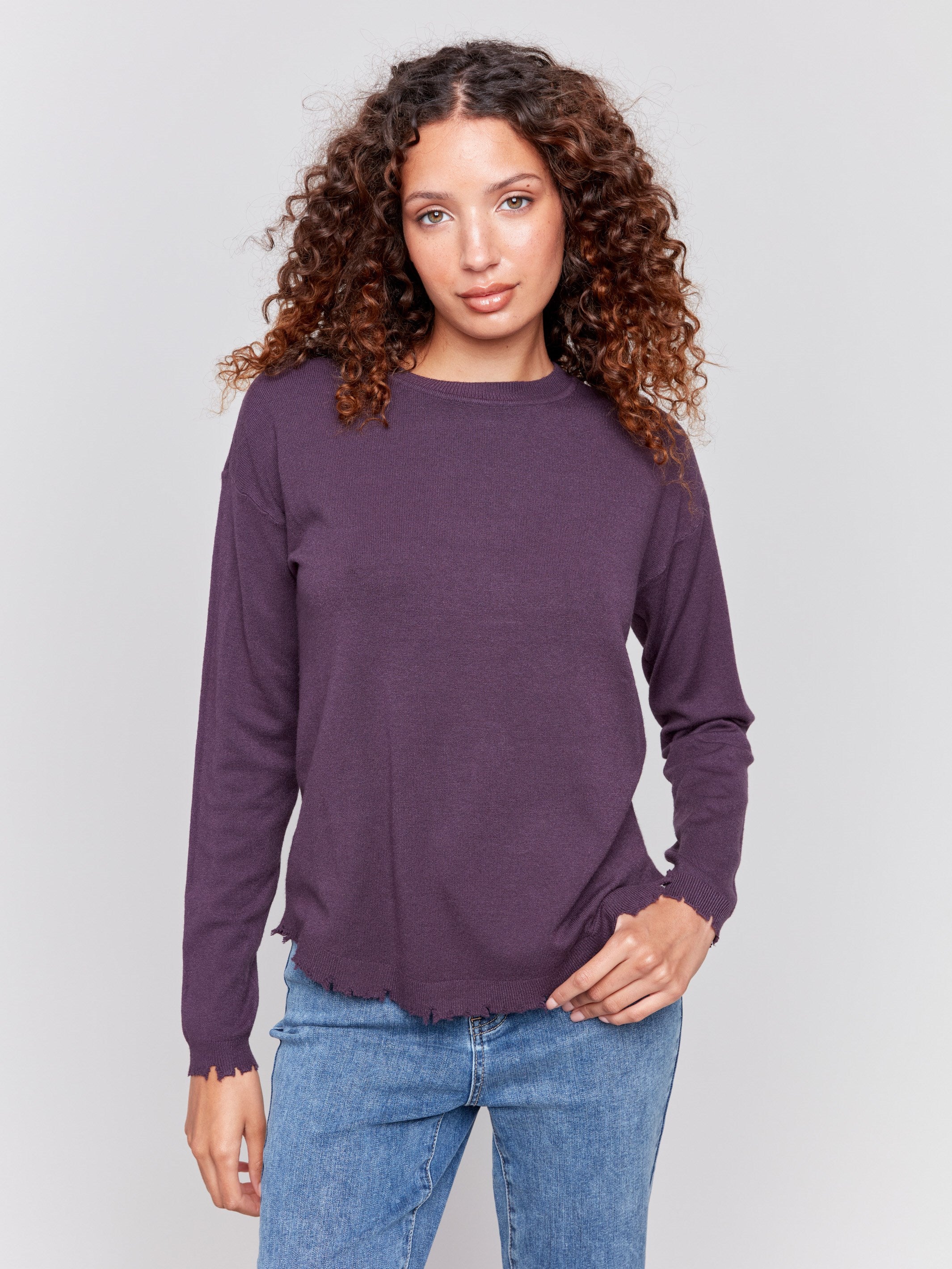 Plum purple long-sleeve sweater with a crew neck and frayed rounded hem by Charlie B.